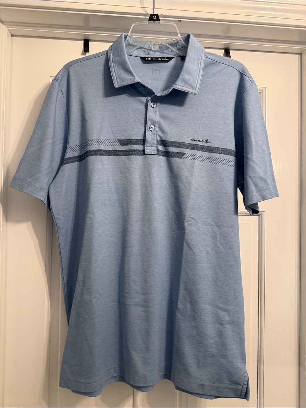 Travis Mathew Light Blue Polo with Navy Stripe Detail